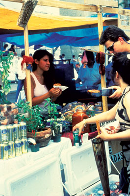 Shoppers hang out at the Adams-Morgan market.